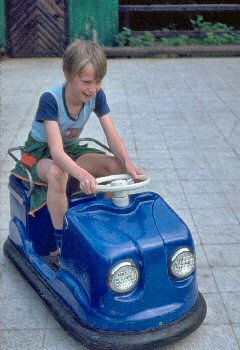 Picture of Armin on a toy car