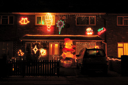 Picture of a house with Christmas lights and Winnie the Pooh