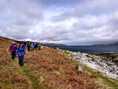 Picture of walkers walking along the coast