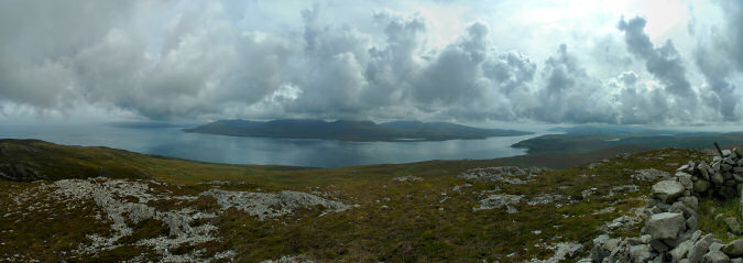 Picture of a view from a hill over a sound and some landscape