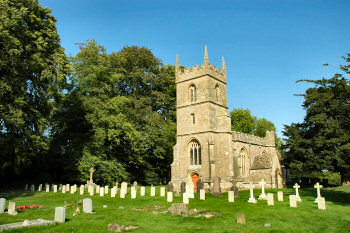 Picture of All Saints Church in Yatesbury, war graves in the foreground