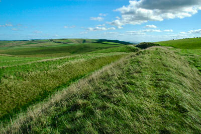 Picture of an earth wall leading into the distance