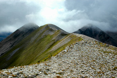 Picture of a mountain ridge with low clouds