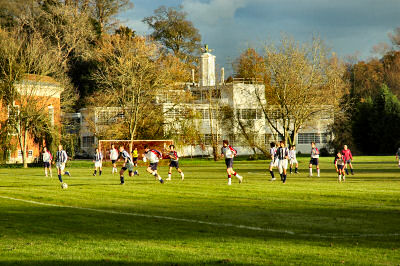 Picture of a football game in the autumn sunshine