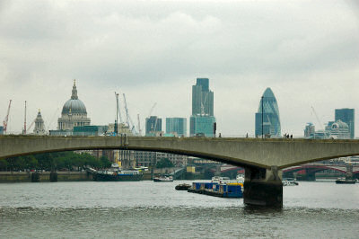 Picture of a river with a bridge and a variety of buildings (The Thames in London)