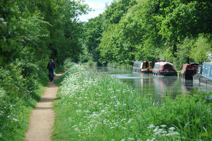 Picture of cyclists on a towpath next to a canal