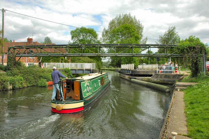 Picture of a canal boat going through a swing bridge