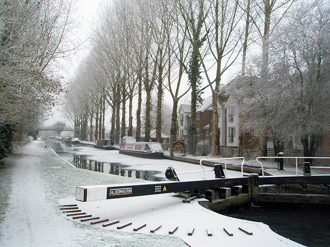 Picture of the end of a canal lock, looking along a wintry canal