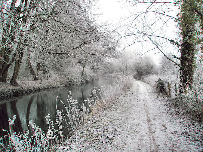 Picture of a canal with a tow path in the winter