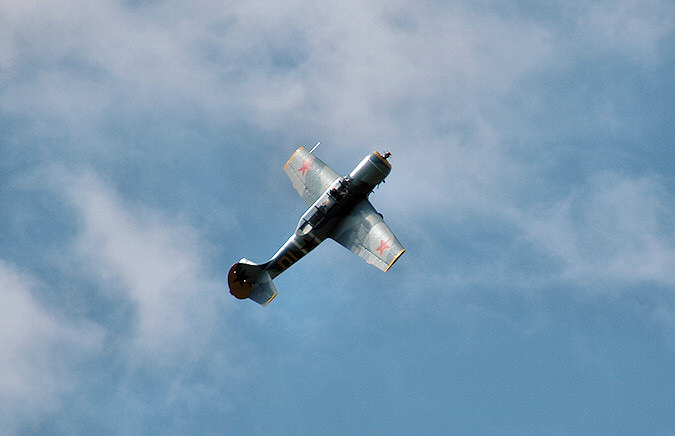 Picture of a Russian training plane, a Yak-52, in flight