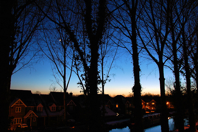 Picture of a view over a canal at last light on a clear cold winter day
