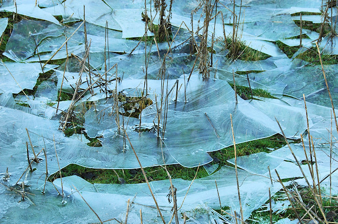 Picture of ice breaking up after the water under it had run off